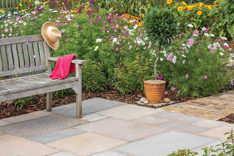 Cottage style patio featuring Global Stone Country Buff Indian Sandstone paving